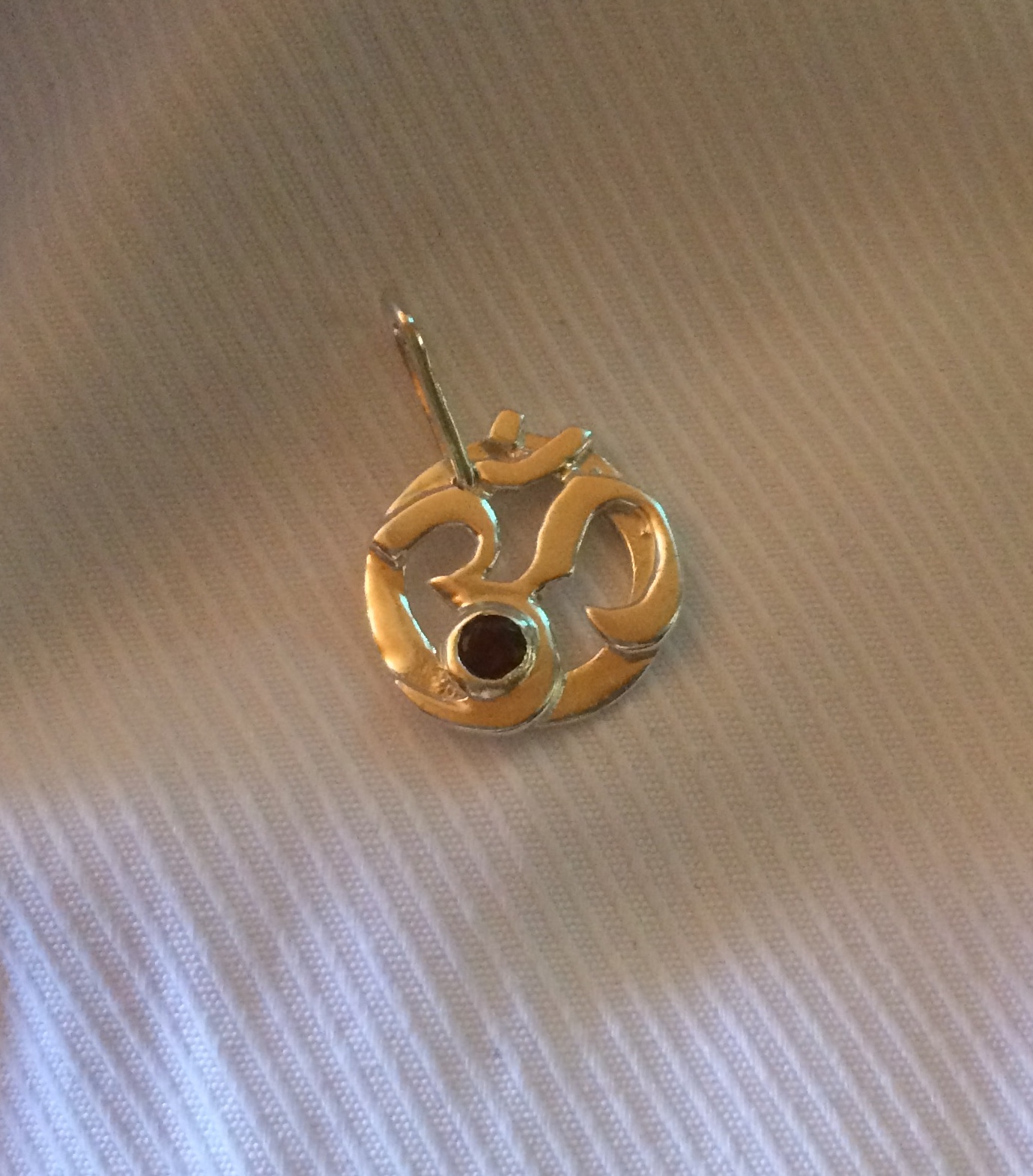 Ohm silver pendant with Garnet Gemstone.