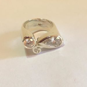 Bold silver ring with pear shaped & round cubic zirconia